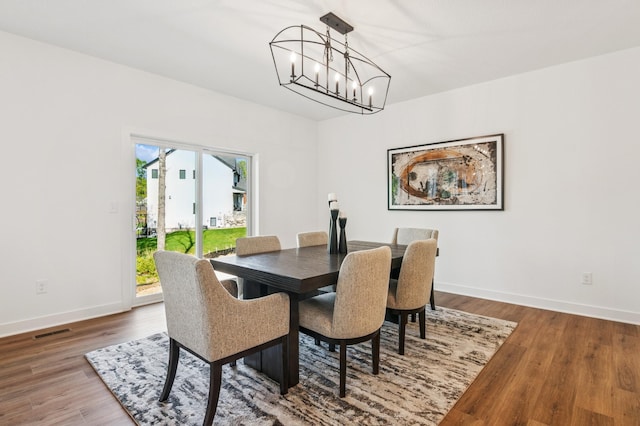 14633 Packard St NE, Ham Lake, MN 55304 - dining room with a chandelier and wood finished floors