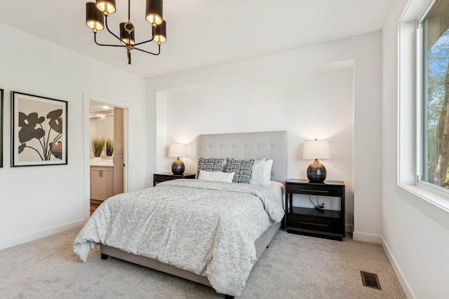 14633 Packard St NE, Ham Lake, MN 55304 - bedroom with carpet flooring, a chandelier, and connected bathroom