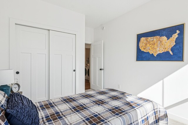 14633 Packard St NE, Ham Lake, MN 55304 - bedroom featuring a closet and washer / dryer
