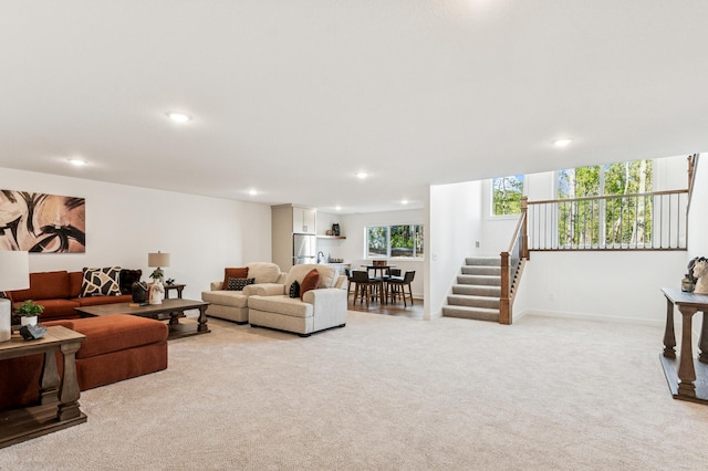 14633 Packard St NE, Ham Lake, MN 55304 - living room featuring light colored carpet, stairway, and recessed lighting
