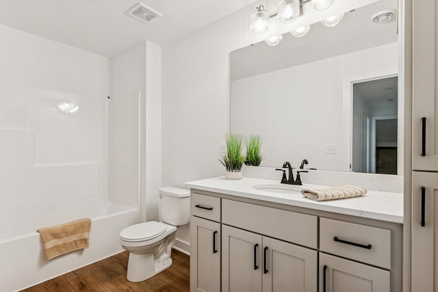 14633 Packard St NE, Ham Lake, MN 55304 - bathroom with vanity, wood finished floors, and shower / washtub combination
