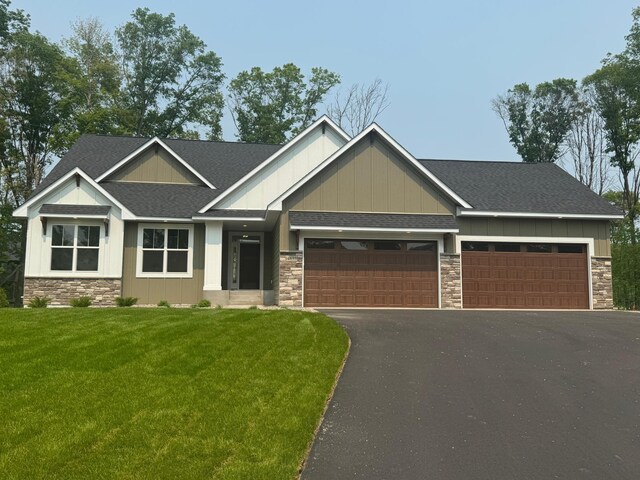 14633 Packard St NE, Ham Lake, MN 55304 - craftsman house with stone siding, board and batten siding, and driveway