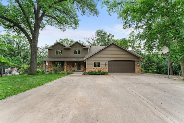 9755 Egret Blvd NW, Coon Rapids, MN 55433 - view of front of home with a garage, driveway, a porch, roof with shingles, and brick siding