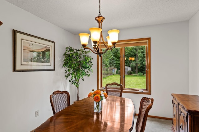 9755 Egret Blvd NW, Coon Rapids, MN 55433 - dining space with a chandelier, a textured ceiling, and light colored carpet