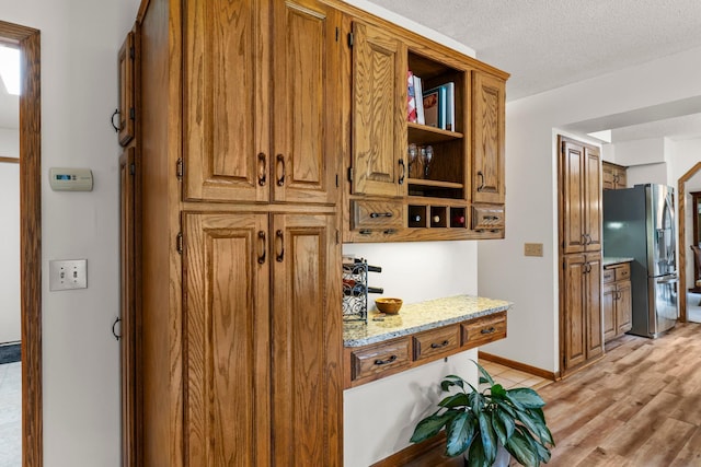 9755 Egret Blvd NW, Coon Rapids, MN 55433 - hall with light wood finished floors and a textured ceiling