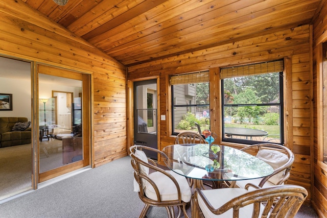9755 Egret Blvd NW, Coon Rapids, MN 55433 - dining space with vaulted ceiling, carpet floors, wood ceiling, and wooden walls