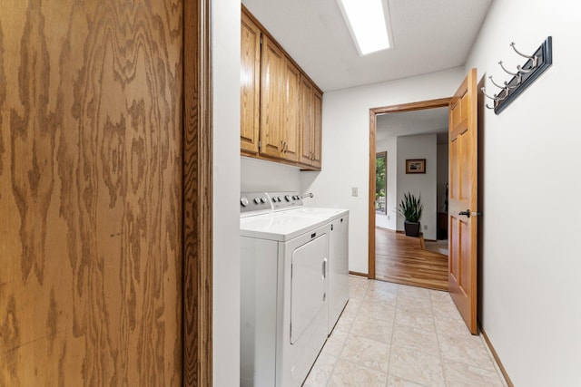 9755 Egret Blvd NW, Coon Rapids, MN 55433 - laundry room featuring cabinet space and independent washer and dryer