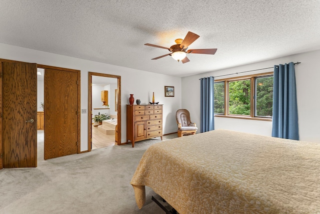 9755 Egret Blvd NW, Coon Rapids, MN 55433 - bedroom featuring light colored carpet, a ceiling fan, ensuite bathroom, and a textured ceiling
