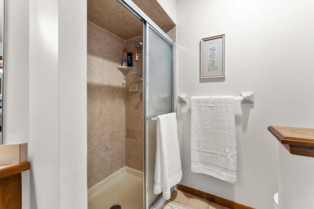 9755 Egret Blvd NW, Coon Rapids, MN 55433 - bathroom featuring a stall shower and tile patterned floors