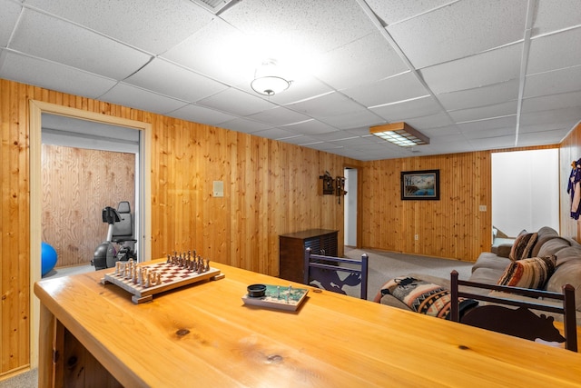 9755 Egret Blvd NW, Coon Rapids, MN 55433 - home office with a drop ceiling, wooden walls, and carpet flooring