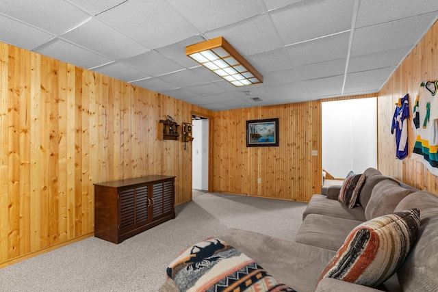 9755 Egret Blvd NW, Coon Rapids, MN 55433 - carpeted living room with wooden walls and a paneled ceiling