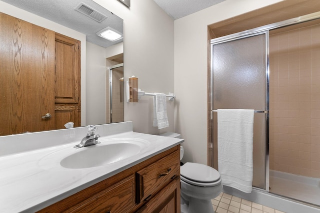 9755 Egret Blvd NW, Coon Rapids, MN 55433 - bathroom featuring vanity, a shower stall, tile patterned flooring, and a textured ceiling