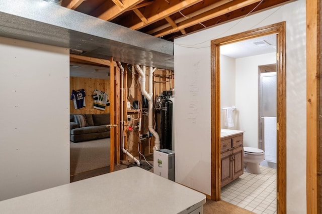 9755 Egret Blvd NW, Coon Rapids, MN 55433 - unfinished below grade area with light tile patterned floors and wooden walls