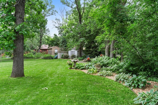 9755 Egret Blvd NW, Coon Rapids, MN 55433 - view of yard with a storage shed
