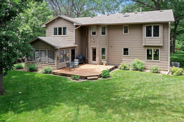 9755 Egret Blvd NW, Coon Rapids, MN 55433 - rear view of house with a deck, a sunroom, a yard, a chimney, and roof with shingles