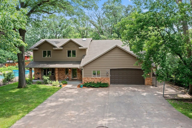9755 Egret Blvd NW, Coon Rapids, MN 55433 - view of front of house with a shingled roof, a garage, driveway, and brick siding