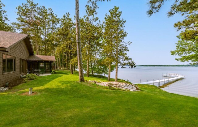 22855 Lake Hubert Dr, Lake Edward Twp, MN 56401 - view of grassy yard featuring a water view, a patio, and a boat dock