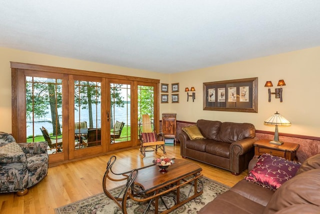 22855 Lake Hubert Dr, Lake Edward Twp, MN 56401 - living room featuring wood finished floors, french doors, and a water view
