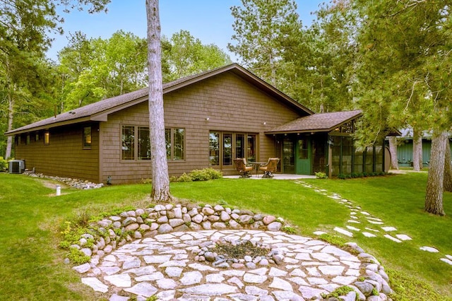 22855 Lake Hubert Dr, Lake Edward Twp, MN 56401 - back of property with a patio, cooling unit, a yard, and a sunroom