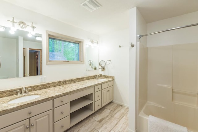 22855 Lake Hubert Dr, Lake Edward Twp, MN 56401 - bathroom with double vanity and bathing tub / shower combination