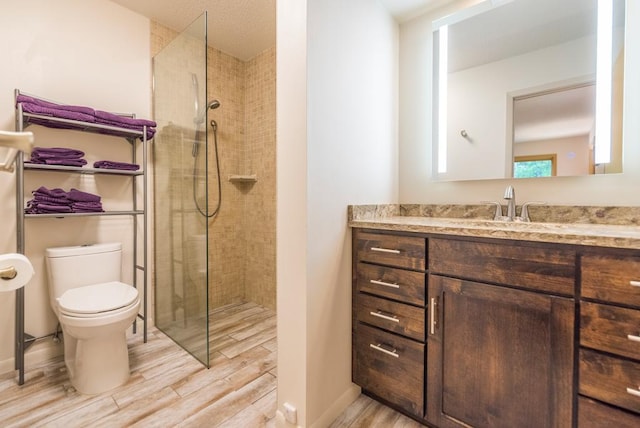 22855 Lake Hubert Dr, Lake Edward Twp, MN 56401 - full bath featuring wood finished floors, vanity, toilet, and walk in shower