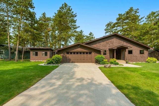 22855 Lake Hubert Dr, Lake Edward Twp, MN 56401 - view of front facade with a garage, driveway, and a front yard