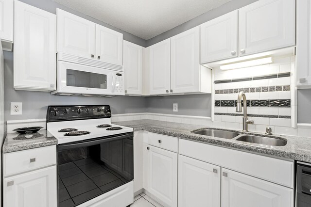 3425 Golfview Dr Unit 308, Eagan, MN 55123 - kitchen featuring range with electric stovetop, white microwave, a sink, white cabinetry, and dishwasher