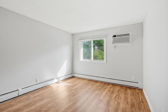 3425 Golfview Dr Unit 308, Eagan, MN 55123 - spare room with an AC wall unit, light wood-type flooring, baseboard heating, and a baseboard radiator