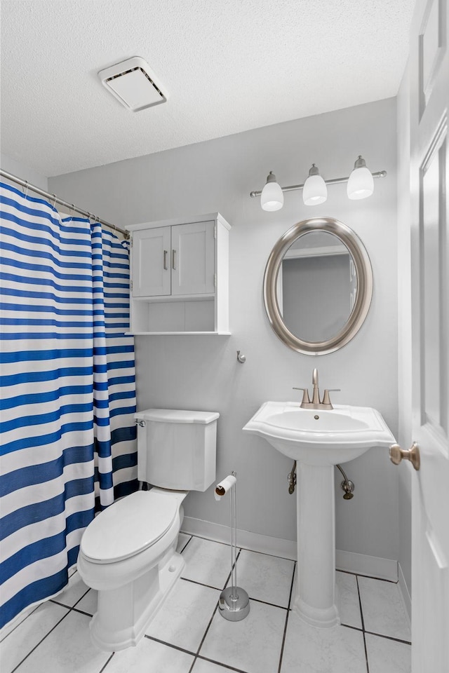 3425 Golfview Dr Unit 308, Eagan, MN 55123 - full bathroom with toilet, baseboards, a textured ceiling, tile patterned floors, and a shower with curtain