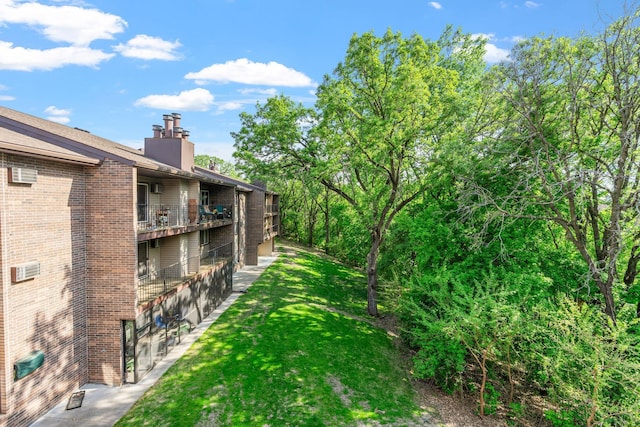 3425 Golfview Dr Unit 308, Eagan, MN 55123 - view of grassy yard featuring a balcony