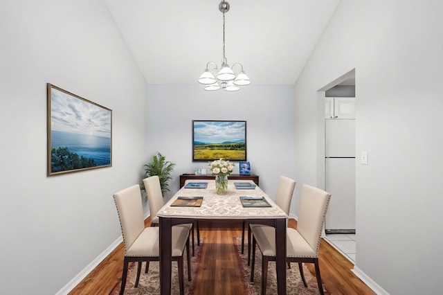 3425 Golfview Dr Unit 308, Eagan, MN 55123 - dining room with a chandelier, lofted ceiling, wood finished floors, and baseboards