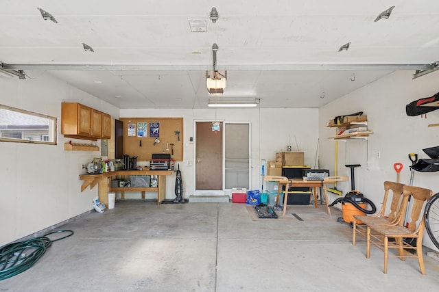 14933 Echo Way, Apple Valley, MN 55124 - garage with a garage door opener and a workshop area