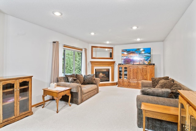12351 Holly St NW, Coon Rapids, MN 55448 - living area with carpet flooring, recessed lighting, and a glass covered fireplace