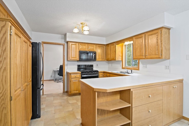12351 Holly St NW, Coon Rapids, MN 55448 - kitchen featuring black appliances, a sink, a peninsula, light countertops, and open shelves