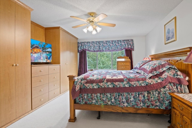 12351 Holly St NW, Coon Rapids, MN 55448 - carpeted bedroom featuring a ceiling fan and a textured ceiling