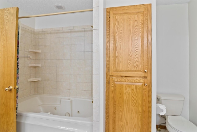 12351 Holly St NW, Coon Rapids, MN 55448 - bathroom featuring toilet and a combined bath / shower with jetted tub