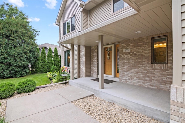 12351 Holly St NW, Coon Rapids, MN 55448 - view of patio featuring a porch
