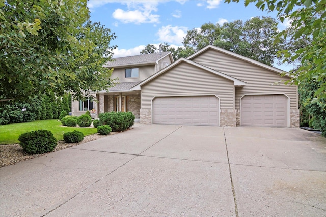 12351 Holly St NW, Coon Rapids, MN 55448 - view of front of home featuring an attached garage, brick siding, driveway, and a front yard