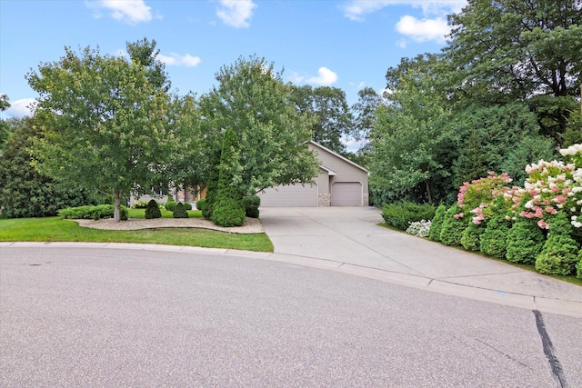 12351 Holly St NW, Coon Rapids, MN 55448 - obstructed view of property with concrete driveway and a garage