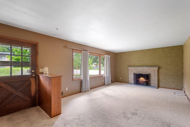 3801 Vandan Rd, Minnetonka, MN 55345 - unfurnished living room featuring light carpet, a fireplace, and baseboards