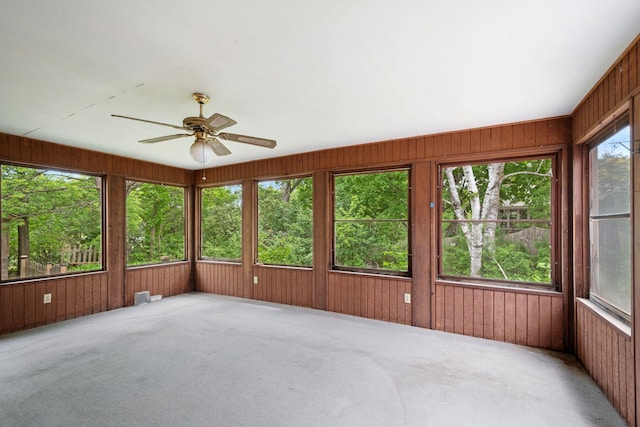 3801 Vandan Rd, Minnetonka, MN 55345 - unfurnished sunroom with a ceiling fan, healthy amount of natural light, wood walls, and carpet
