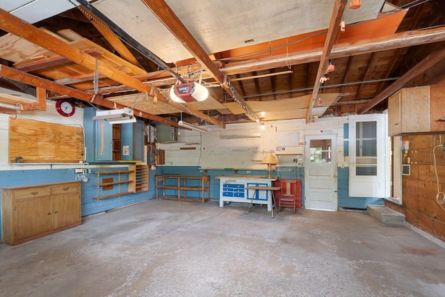 3801 Vandan Rd, Minnetonka, MN 55345 - garage with a workshop area and a garage door opener