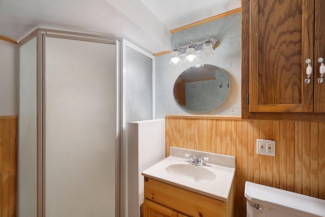 3801 Vandan Rd, Minnetonka, MN 55345 - bathroom with a shower stall, vanity, toilet, and wooden walls