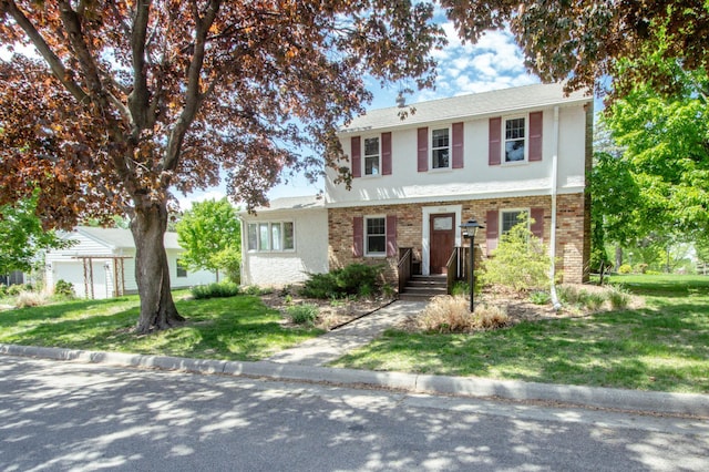 1904 Saunders Ave, Saint Paul, MN 55116 - view of front of property with brick siding, a front lawn, and stucco siding