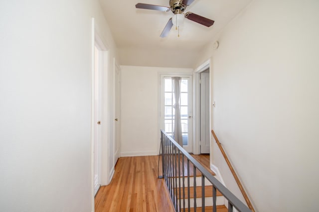 1904 Saunders Ave, Saint Paul, MN 55116 - hall with an upstairs landing, light wood-style flooring, and baseboards