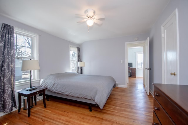 1904 Saunders Ave, Saint Paul, MN 55116 - bedroom with multiple windows, light wood-style floors, baseboards, and ceiling fan