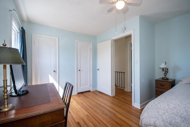 1904 Saunders Ave, Saint Paul, MN 55116 - bedroom featuring light wood-type flooring, baseboards, two closets, and a ceiling fan