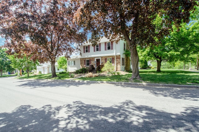 1904 Saunders Ave, Saint Paul, MN 55116 - townhome / multi-family property with stucco siding and a front yard