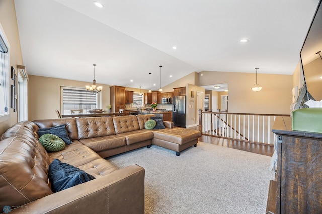 5409 47th Ave S, Fargo, ND 58104 - living area featuring lofted ceiling, a chandelier, light colored carpet, and recessed lighting