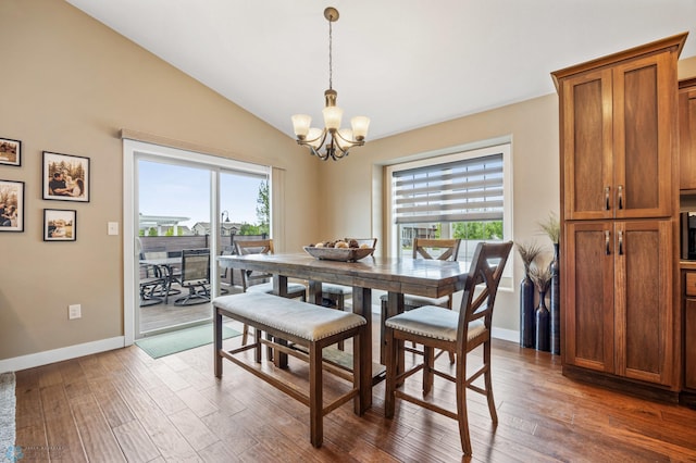 5409 47th Ave S, Fargo, ND 58104 - dining room with a chandelier, plenty of natural light, lofted ceiling, and hardwood / wood-style flooring
